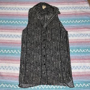 Black and cream striped sleeveless button down blouse